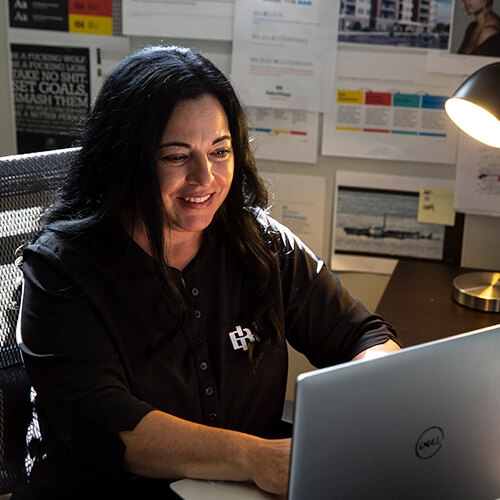 BakerHopp employee working on computer