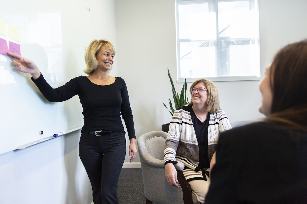 BakerHopp employees in conference room